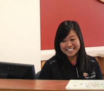 student at the info desk