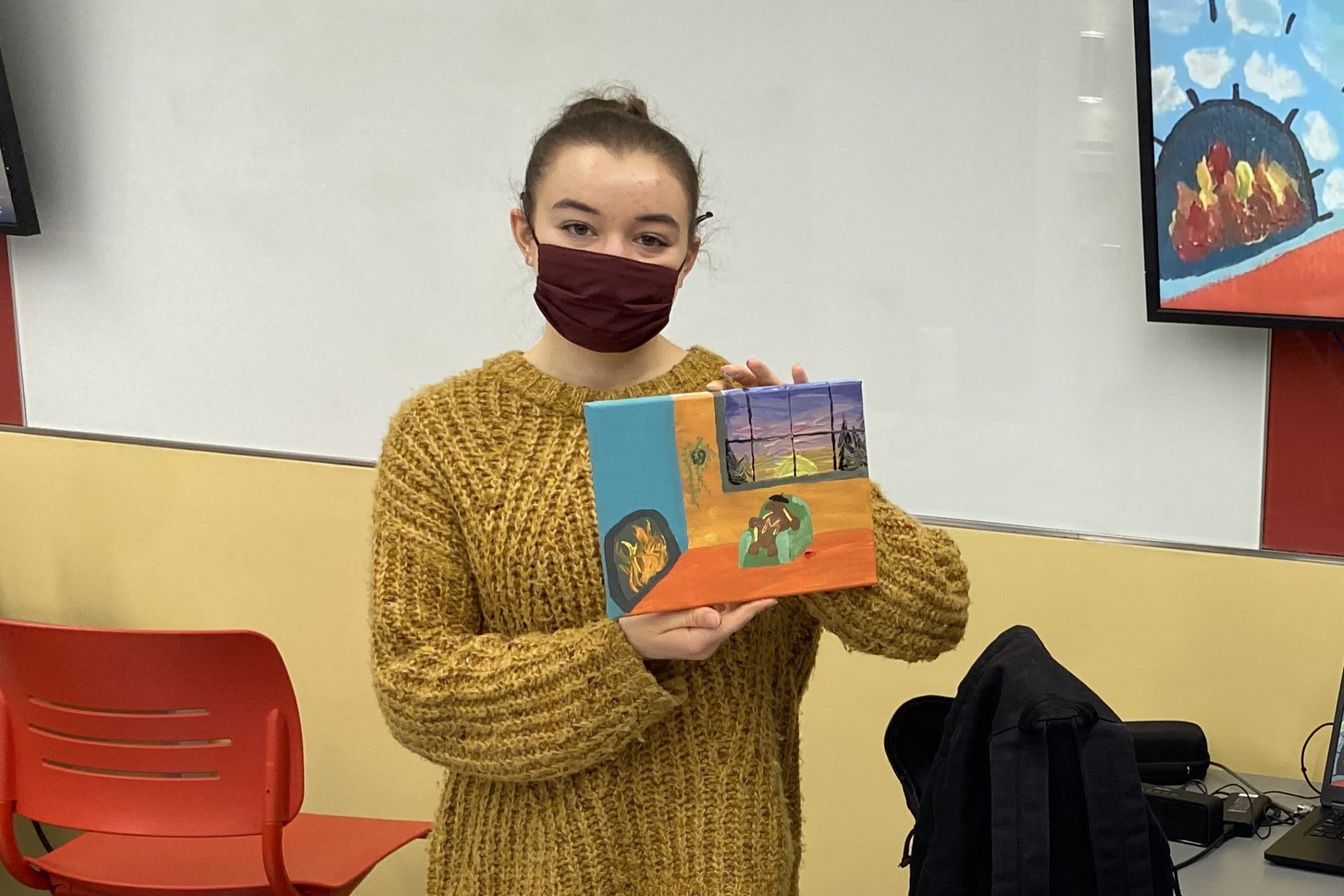 person holding a painting