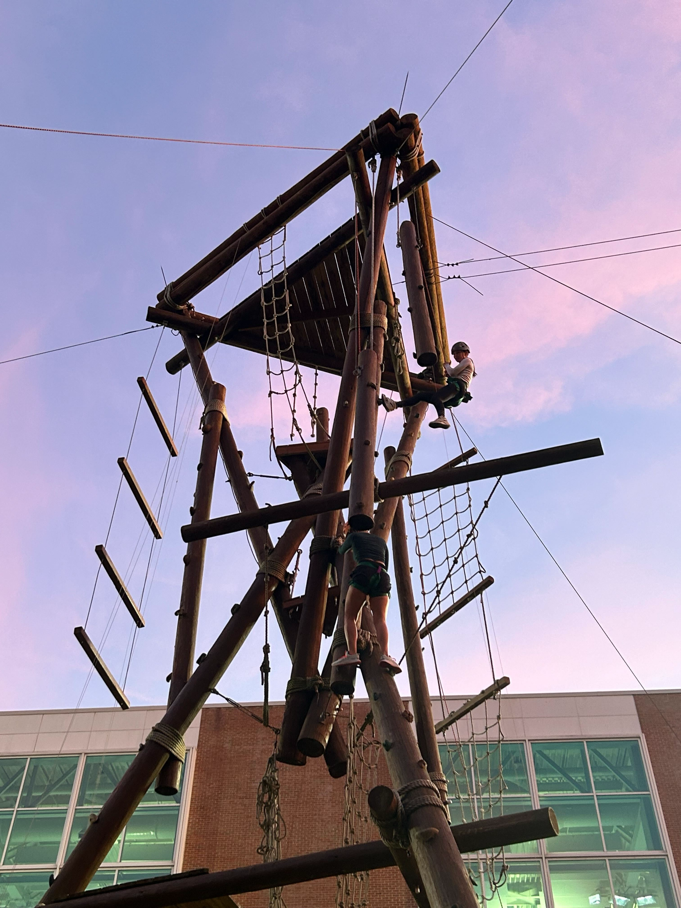 students climbing tower at rec well challenge course