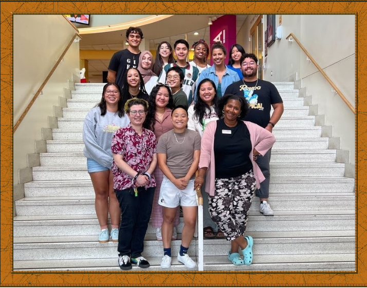 MICA staff members standing as a group on five levels of steps leading to STAMP's Studio A 