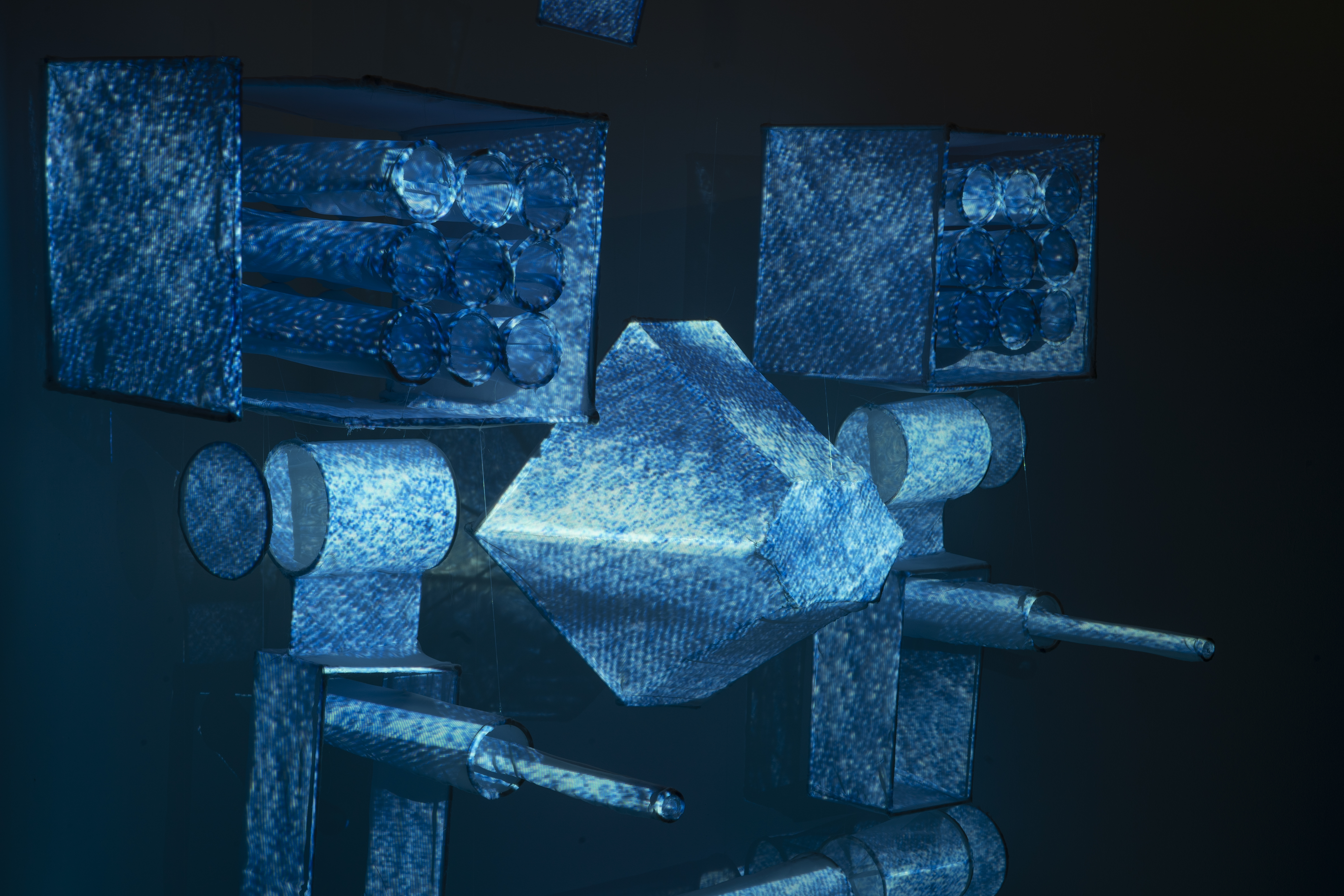 Noah McWilliams art piece - illuminated blue geometric shapes