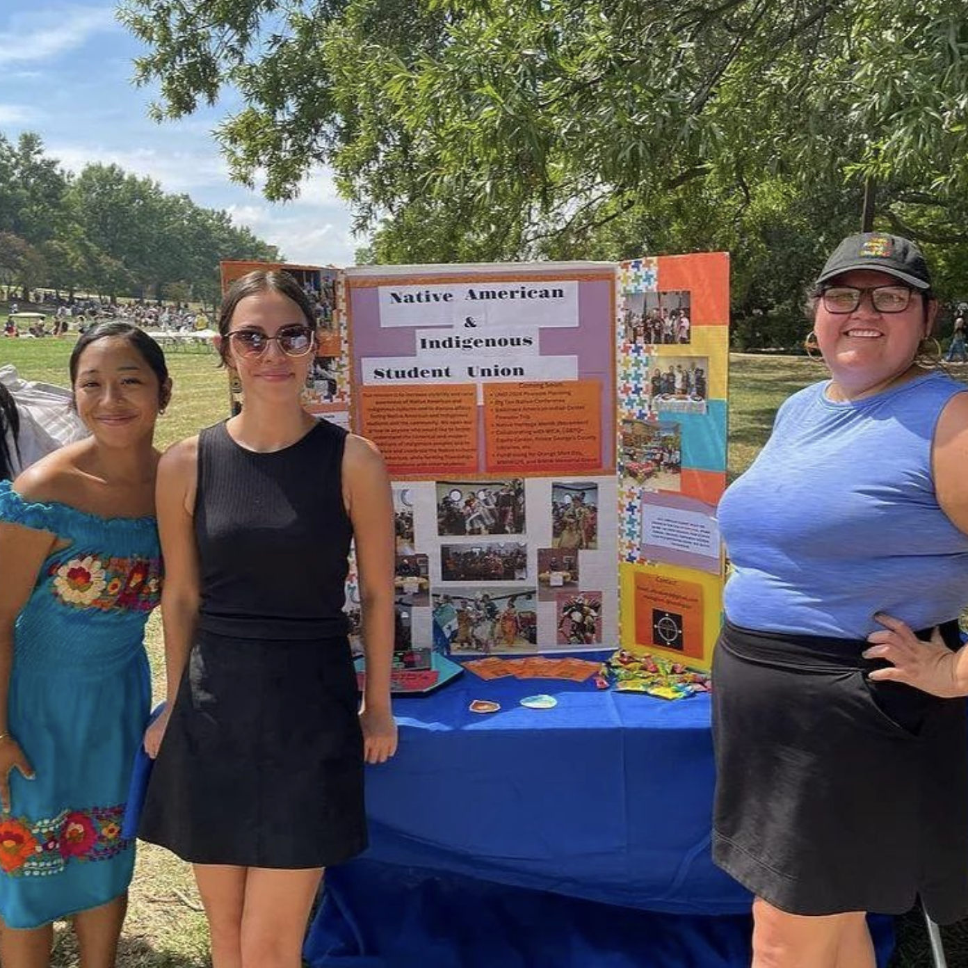 students in front of a poster board