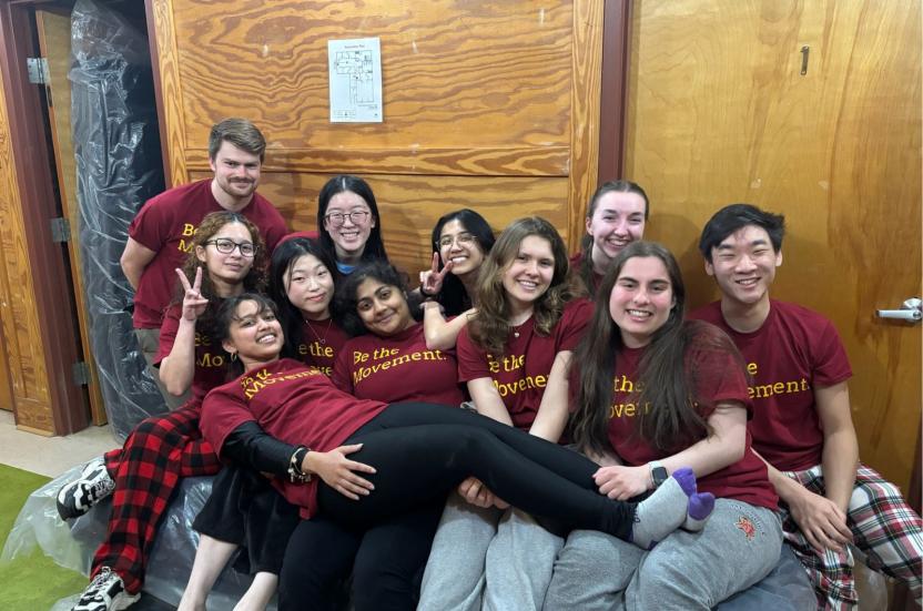 AB team poses together after a day of service. 