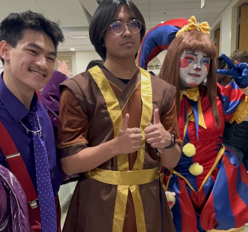 Three students in cosplay pose