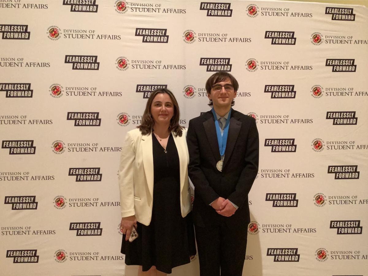Photobooth photo of an award recipient and a guest