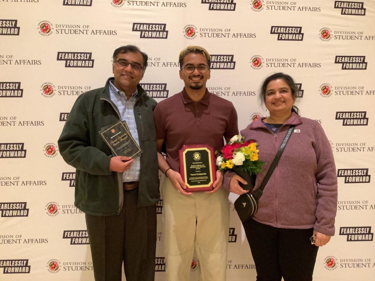 Photobooth photo of an award recipient and his family