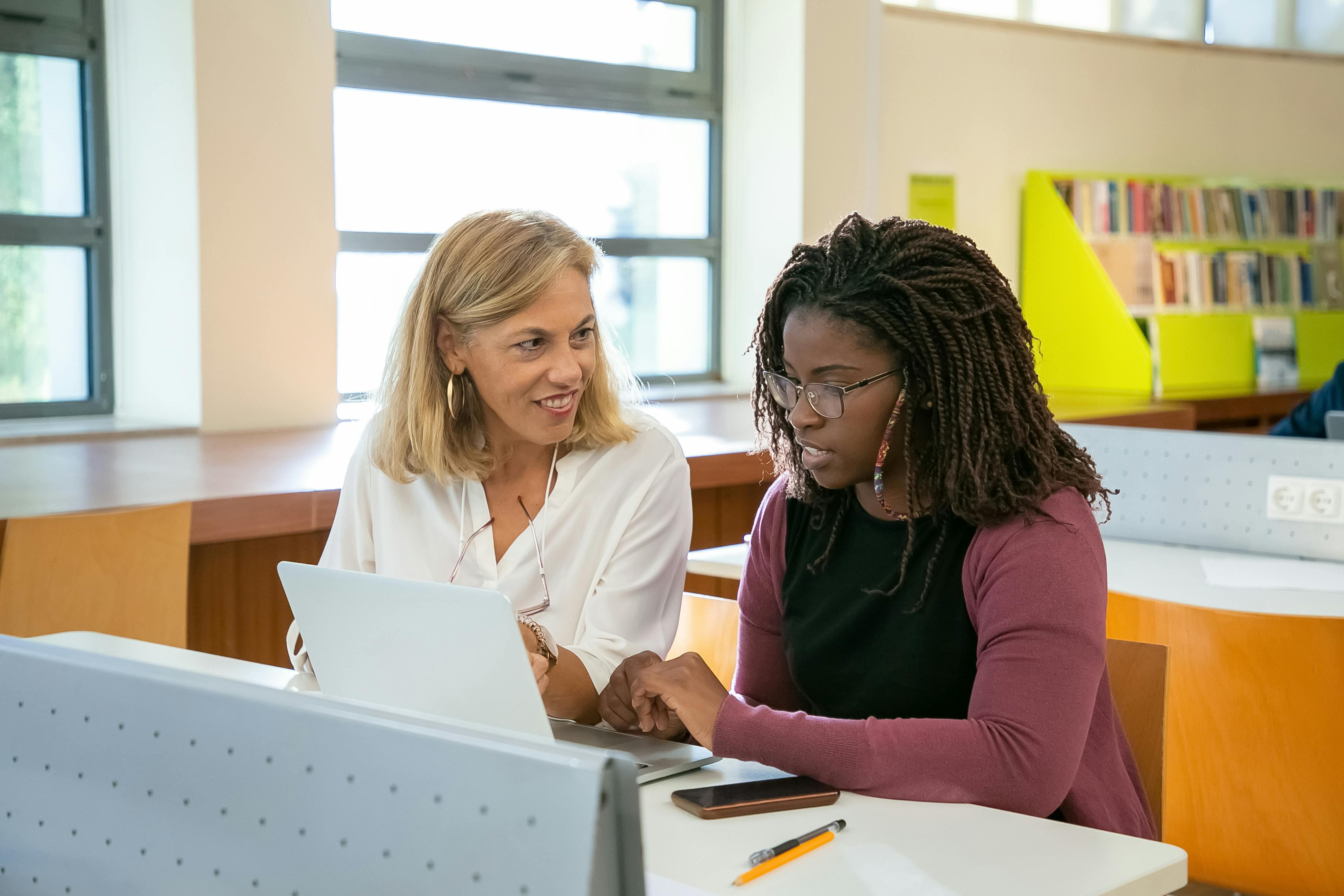woman helping a student