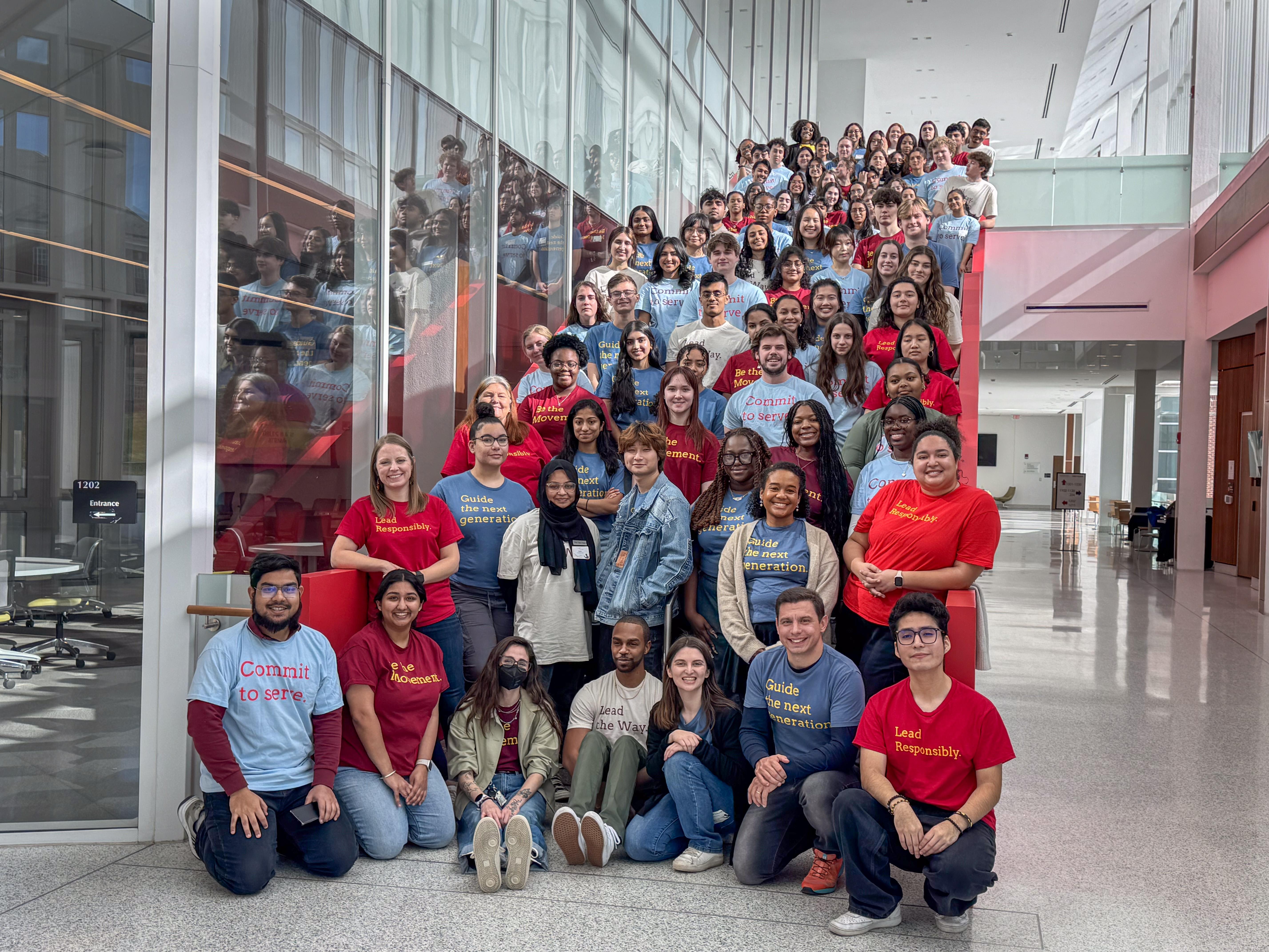 photo of large group of students facing camera smilint