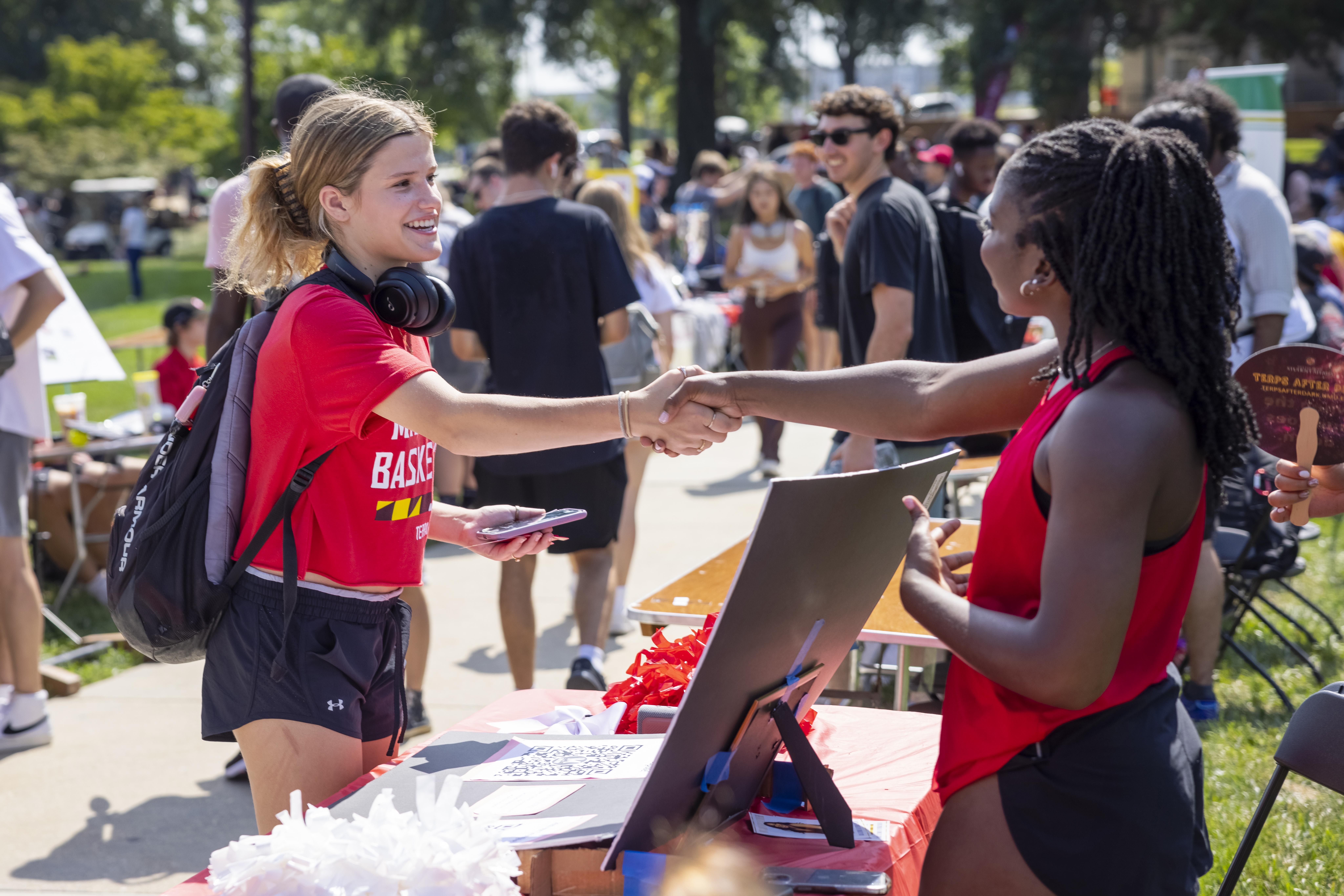 two students shaking hands