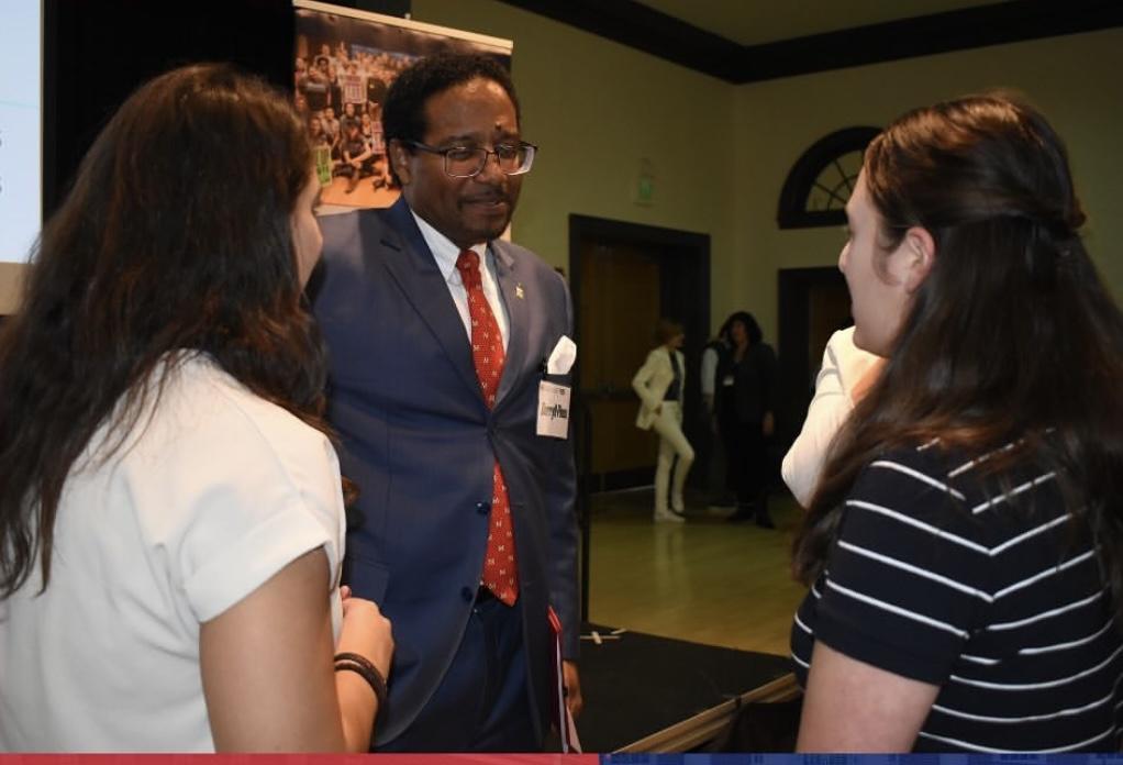 students talking to President Pines