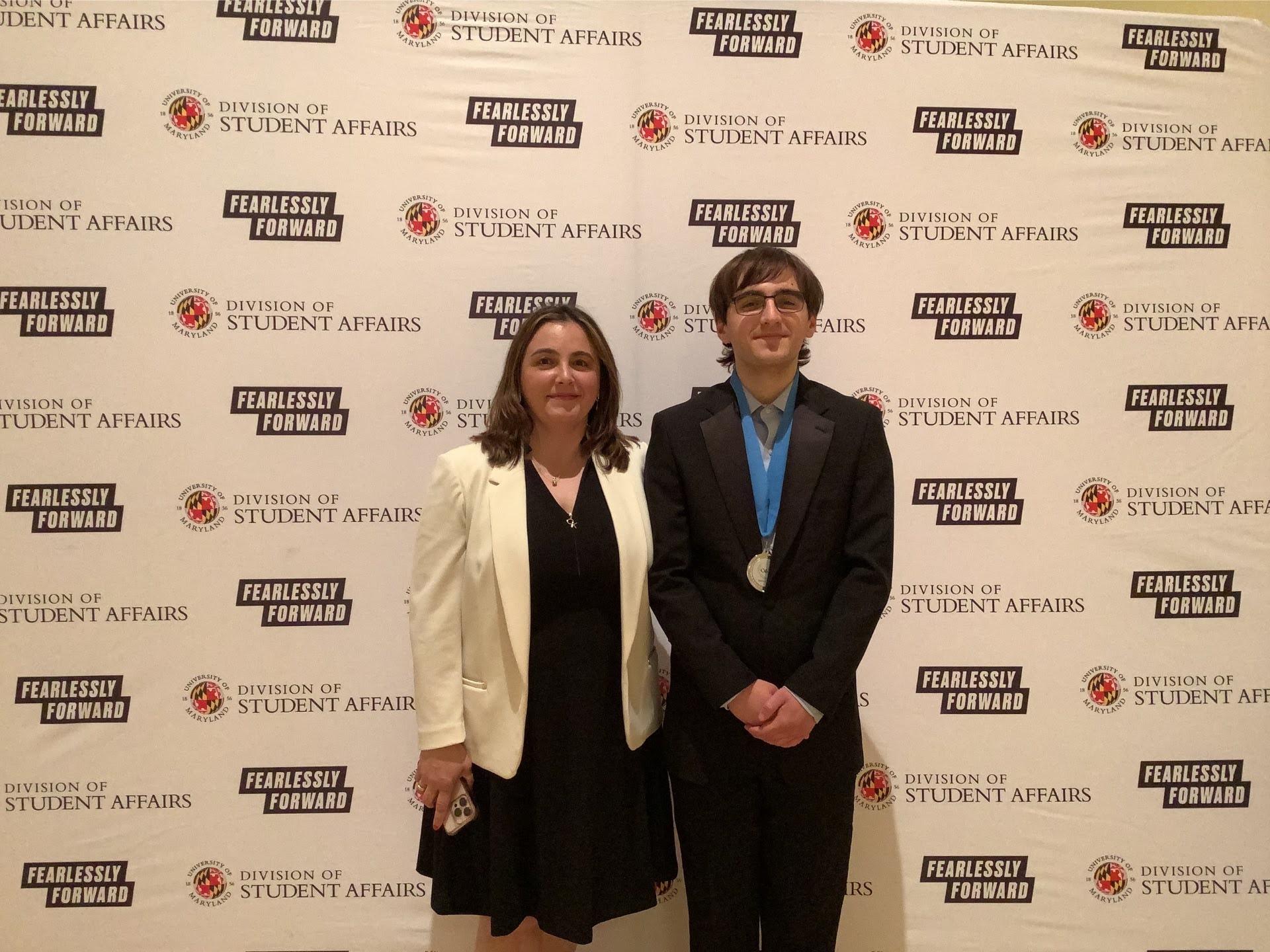 Photobooth photo of an award recipient and a guest