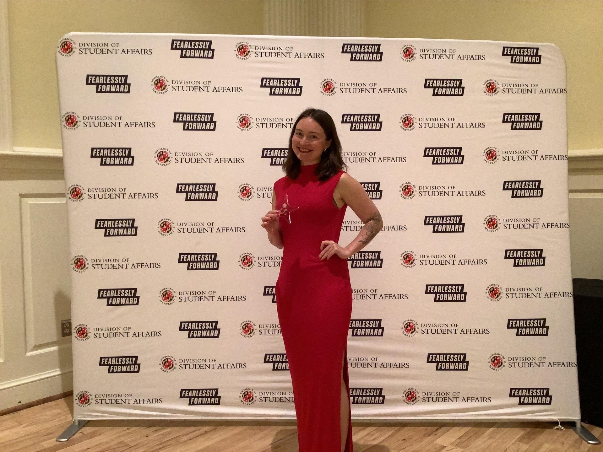 Photobooth photo of and award recipient hold her award