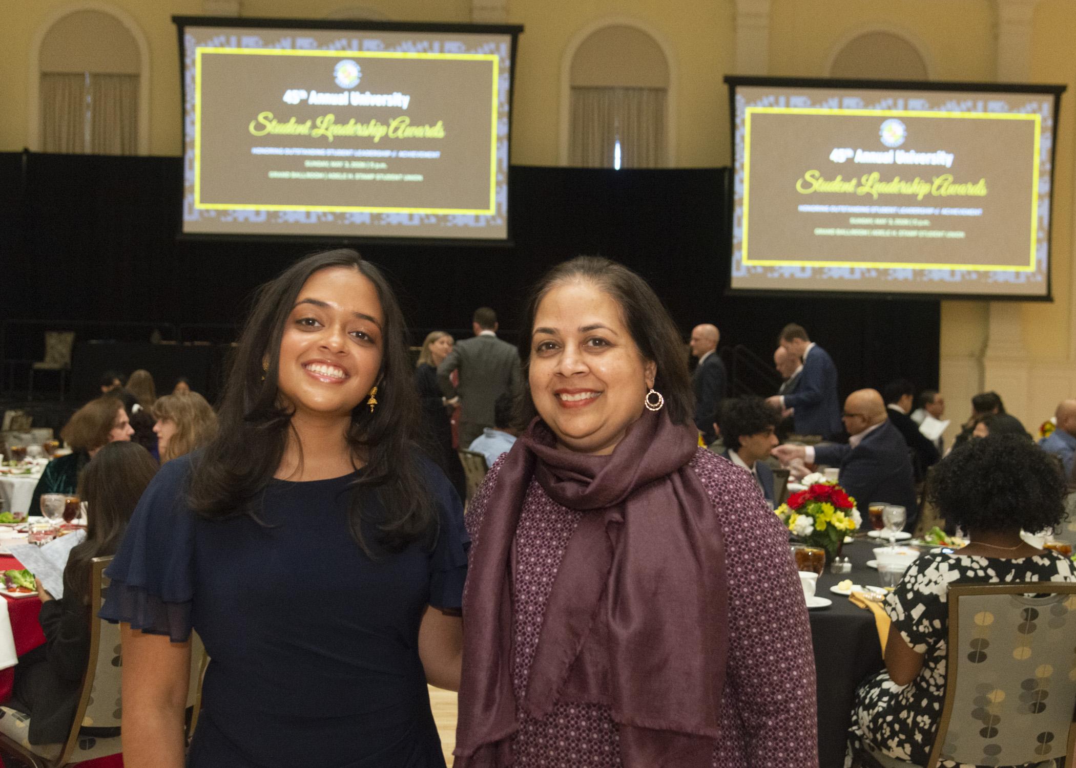 Image of award recipient, Ela Jalil and her guest