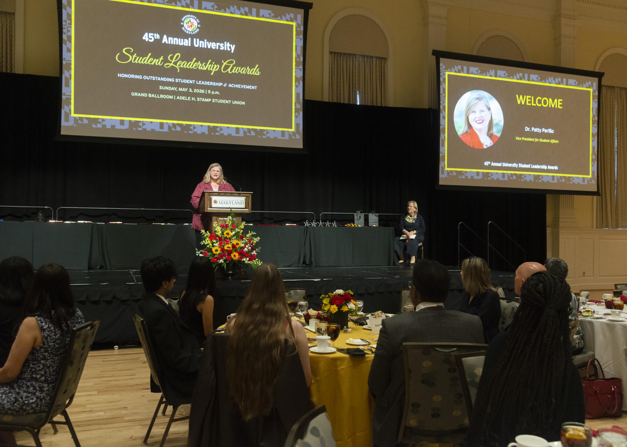 Photo of Patty Perillo, VP for Student Affairs, speaking on stage