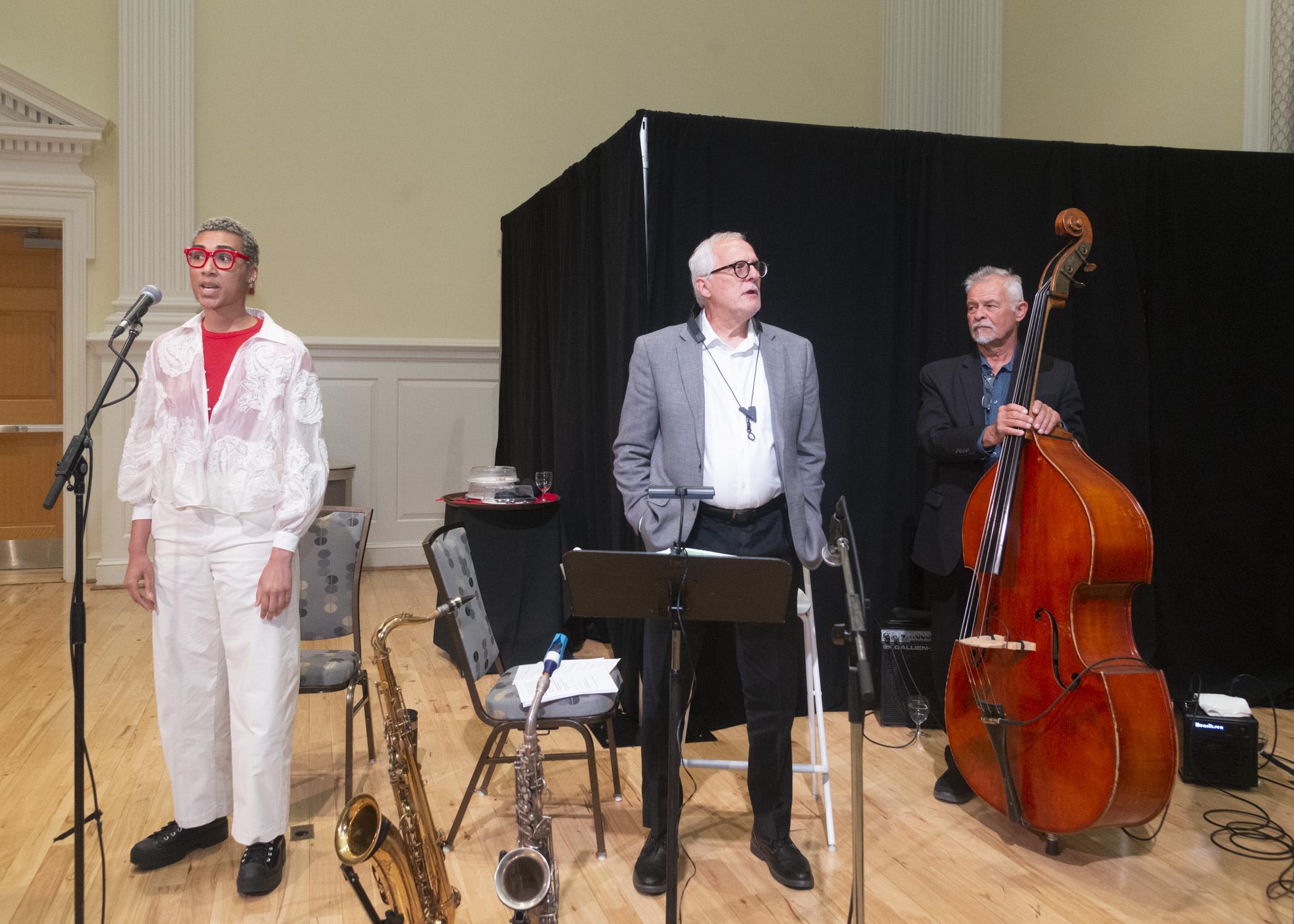 A photo of the singer and the band performing the UMD alma mater