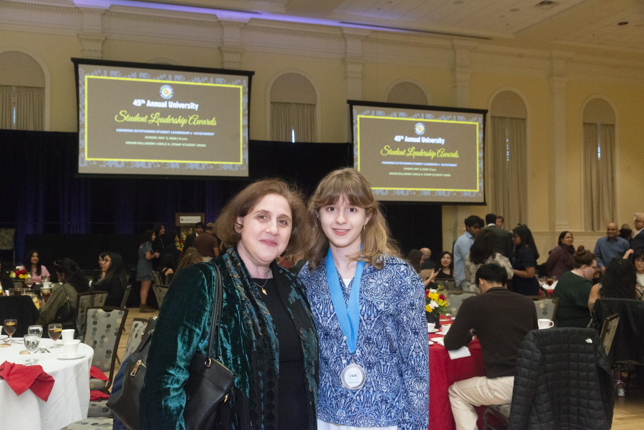 A photo of one of the ODK Top ten Freshaman standing with her guest