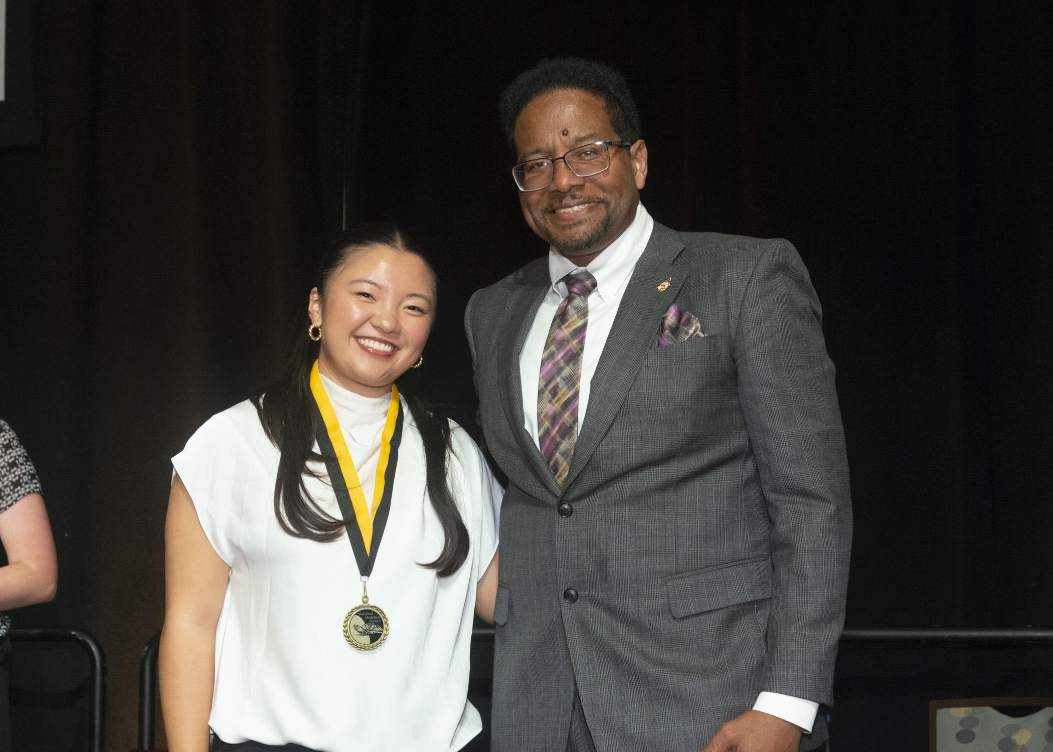 President Pines and a member of the maryland medallion society
