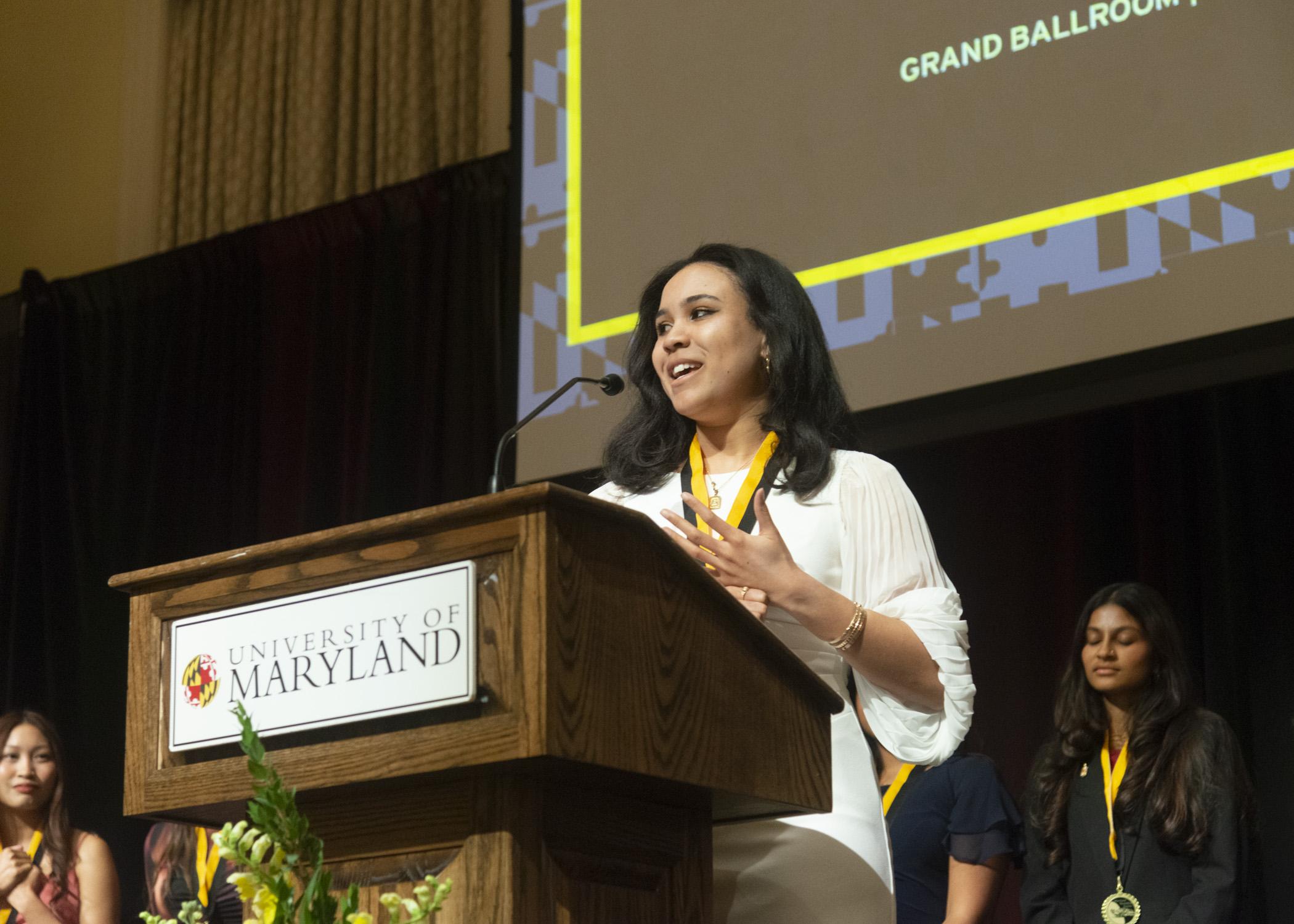 A photo of Gabrielle Hester giving a speech after recieving an award
