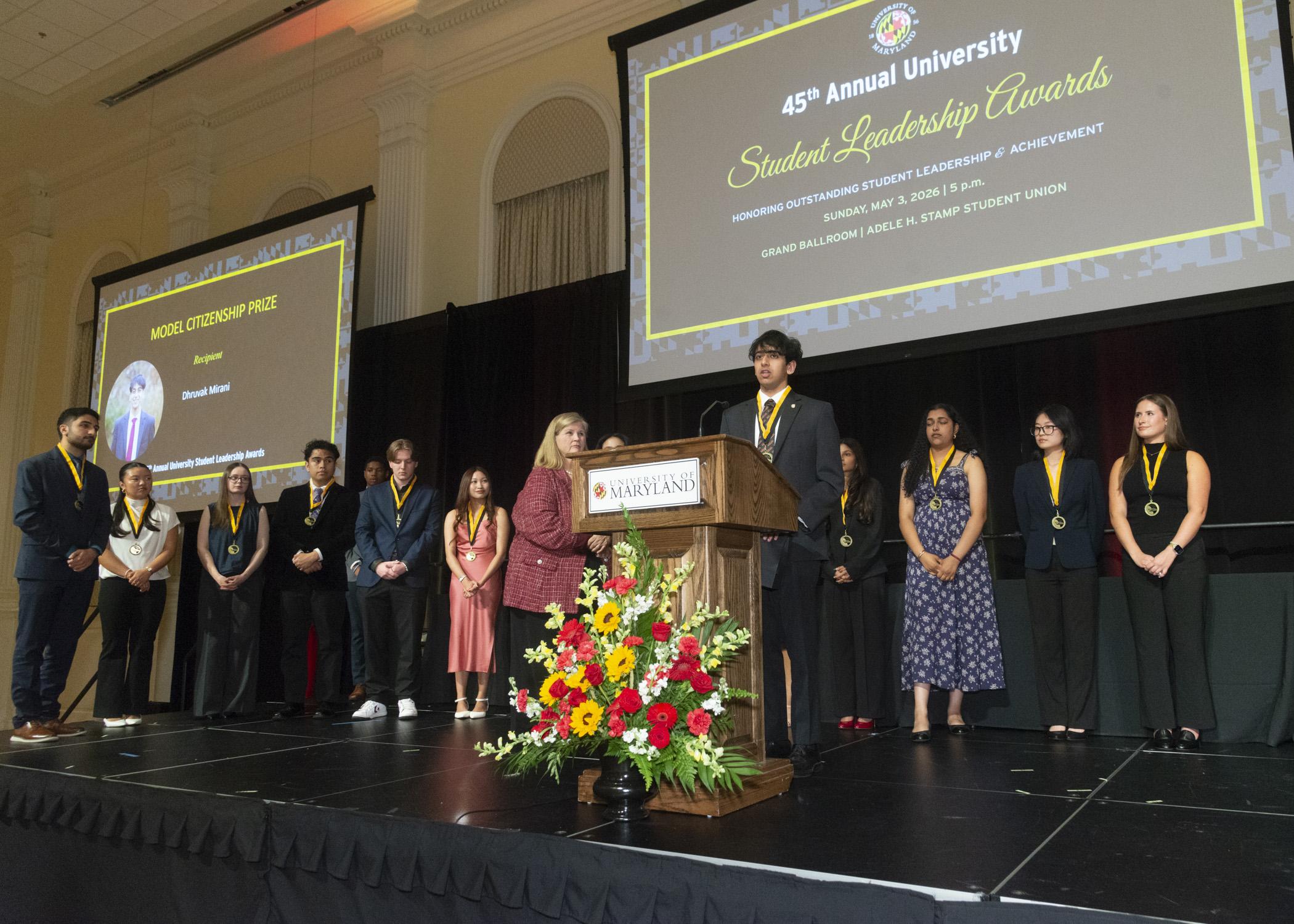 A photo of the Model Citizenship Prize recipient, Dhruvak Mirani giving a speech