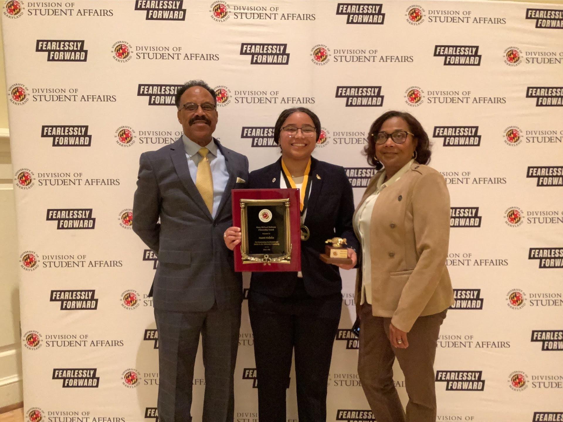 Photobooth photo of an award recipient and her family