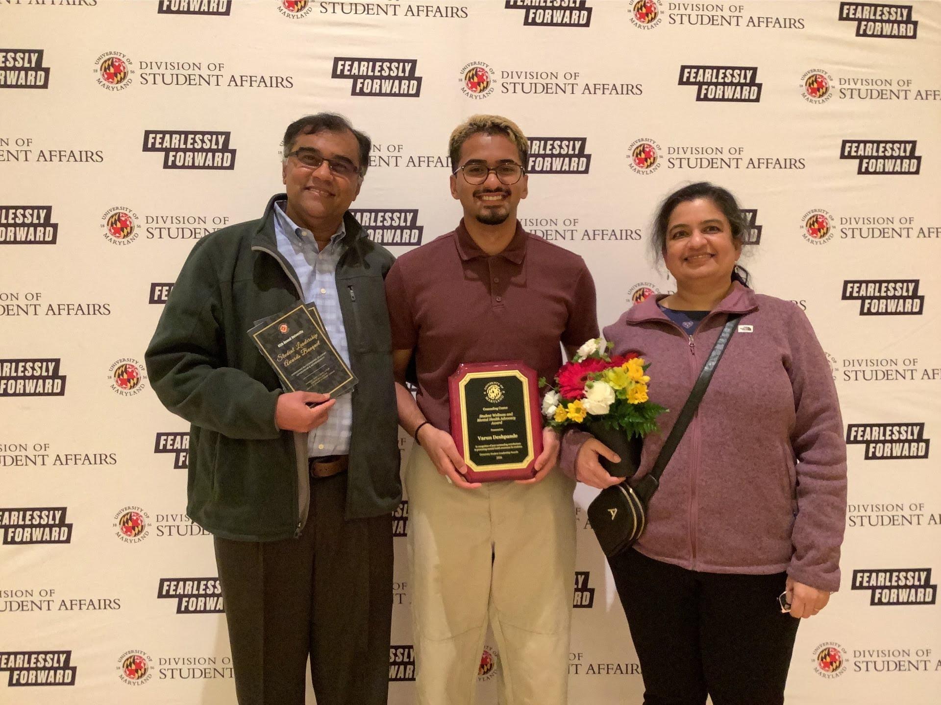 Photobooth photo of an award recipient and his family