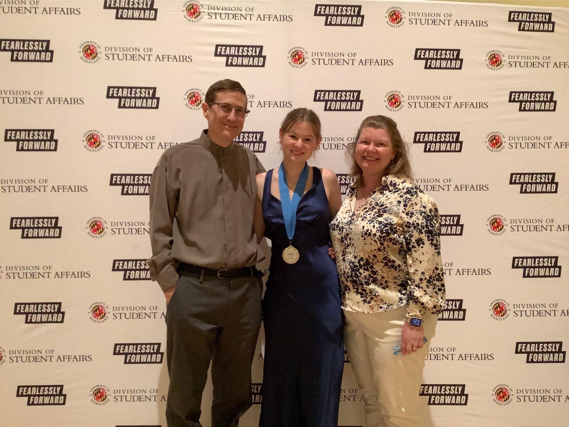 Photobooth photo of an award recipient and her family