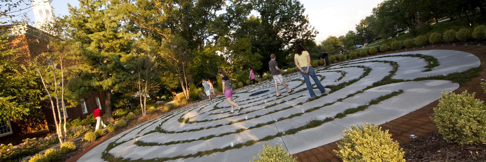 people walking on the labyrinth outside Memorial Chapel.