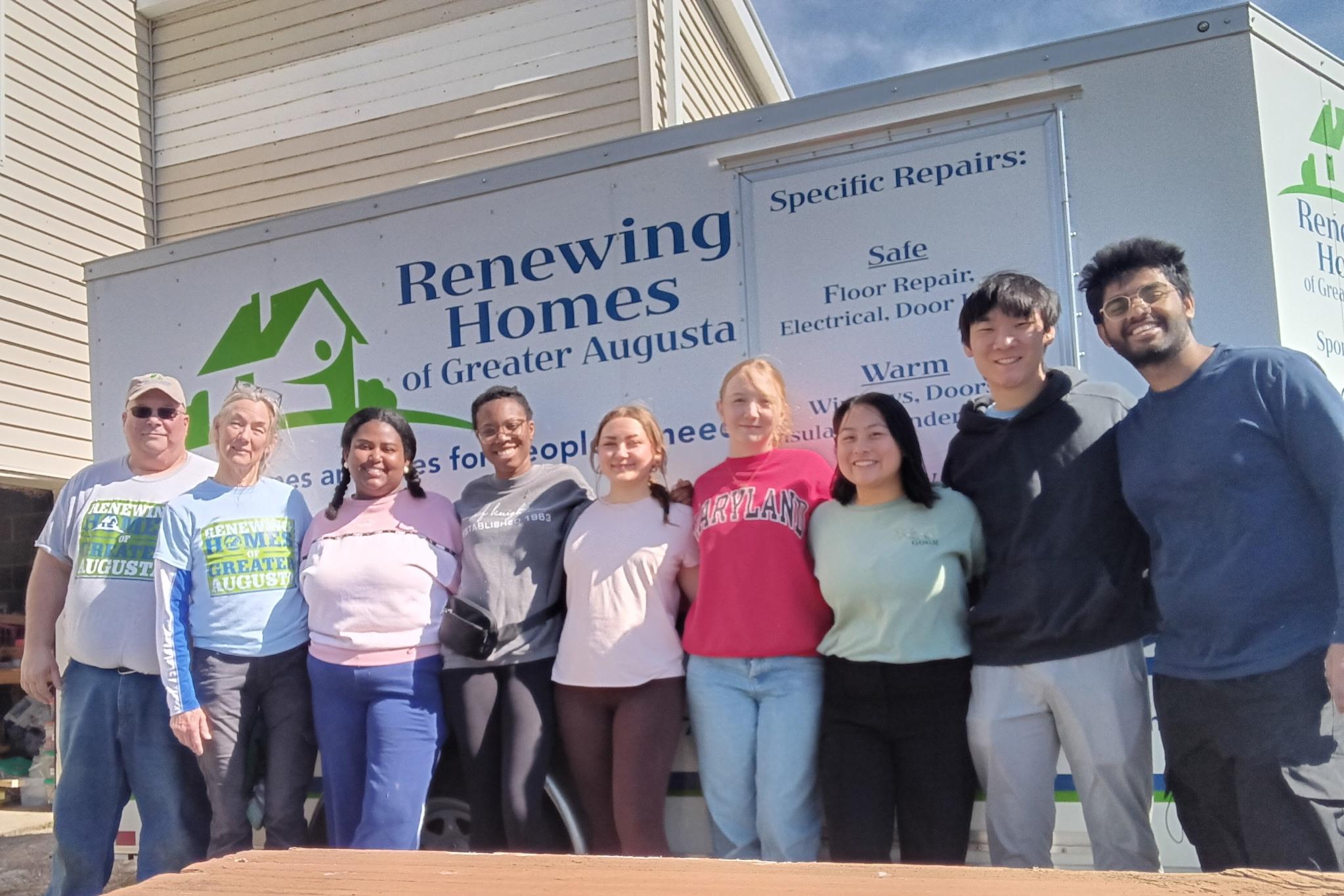 The AB team in Staunton, VA poses in front of a truck with their community partner's name on it (Renewing Homes of Greater Augusta)