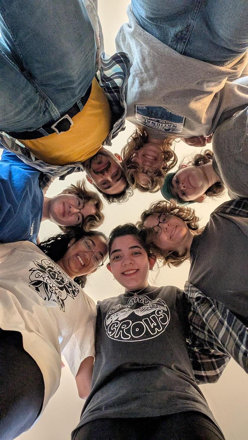 An AB team poses together after a long day of service